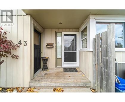 The image shows the front porch of a house with the number 43 on the wall.