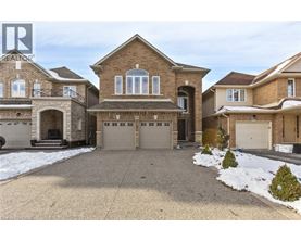 A large house with a driveway in front of it.