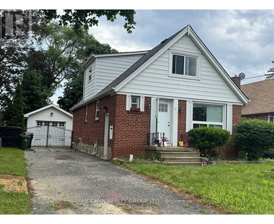 A house with a white garage door and a brick chimney.