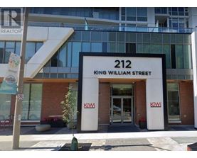 The front of a building with the number 212 and the name King William Street on it.