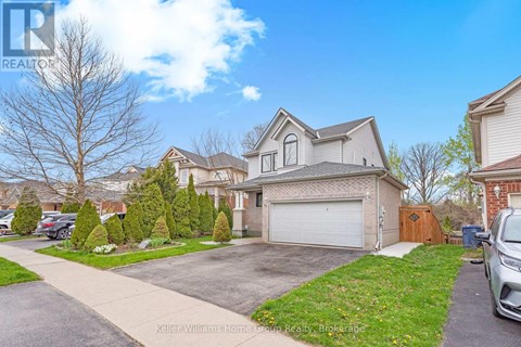 A residential area with a house and a car parked in front.