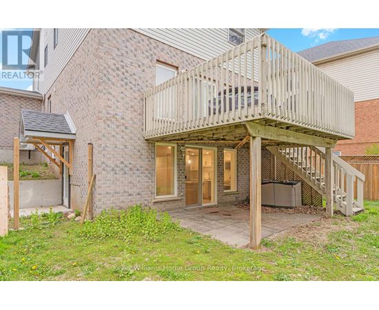 A house with a deck and a hot tub.