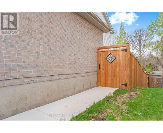 A wooden gate with a diamond pattern in the middle is closed.