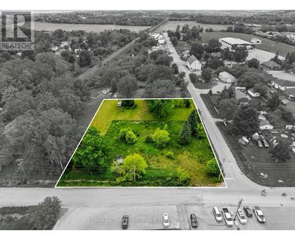 An aerial view of a parking lot with a REMAX sign.