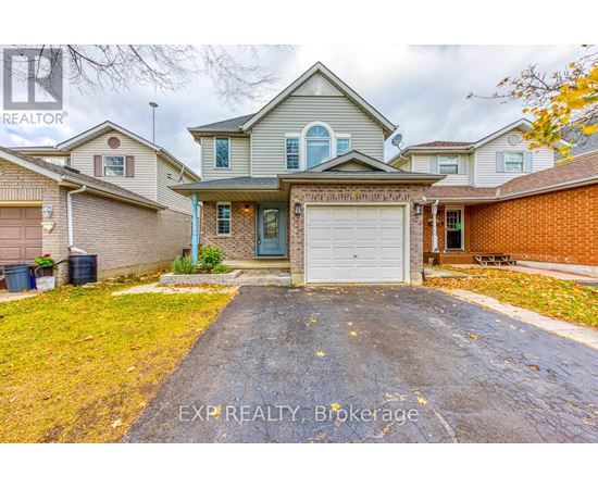 A house with a grey garage door is for sale.
