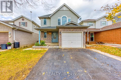 A house with a grey garage door is for sale.