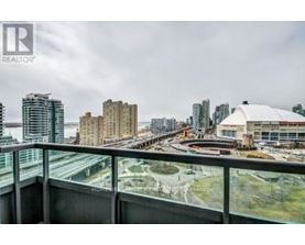 A cityscape viewed from a high-rise building with a realtor logo in the corner.
