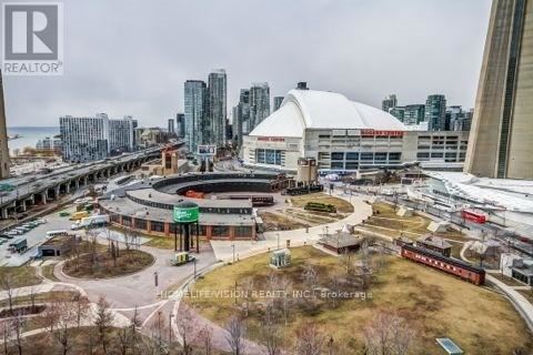 A cityscape with a large white dome structure in the center.