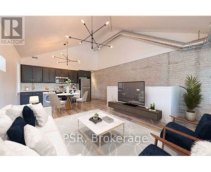 A modern living room with a brick wall and a flat screen TV.