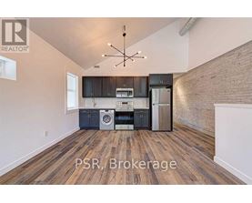 A kitchen with a washer and dryer built in.