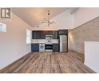 A kitchen with a washer and dryer built in.
