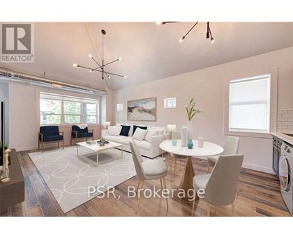 A modern living room with a dining table set up with white chairs.