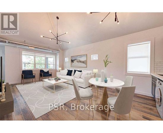 A modern living room with a dining table set up with white chairs.