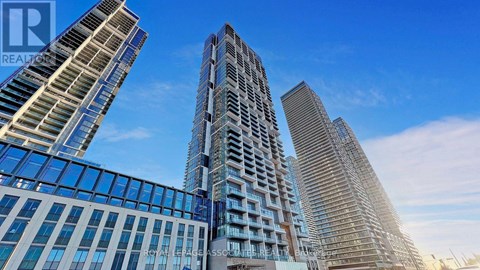 A group of modern high-rise buildings with glass facades.