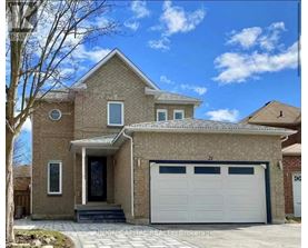 A two-story house with a garage is for sale.
