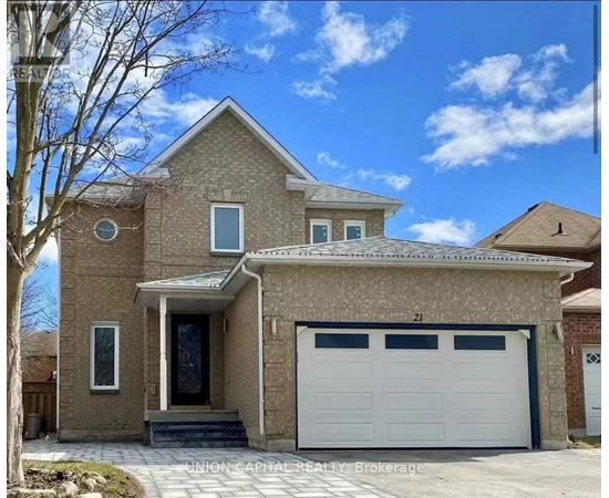 A two-story house with a garage is for sale.