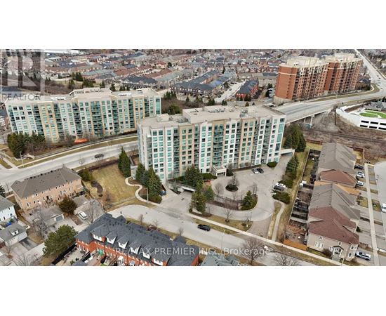 An aerial view of a city with apartment buildings and roads.