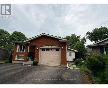 A house with a garage door that says 7643 on it.