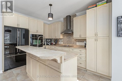 A kitchen with a white counter top and cabinets.