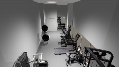 A gym with a row of treadmills and exercise bikes.
