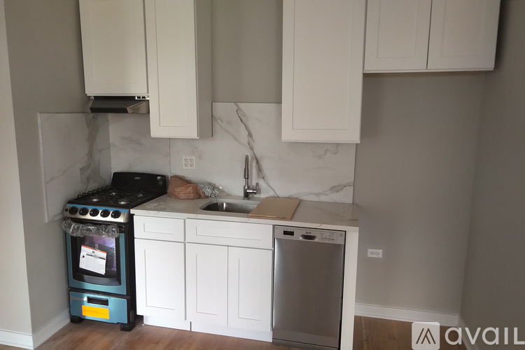 A kitchen with a stove and a dishwasher.