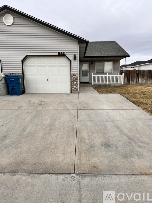 A house with a driveway in front of it.