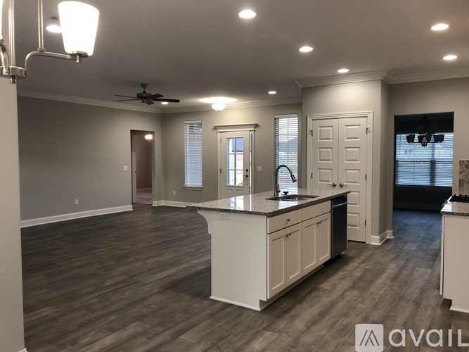 A spacious kitchen with a large island and modern appliances.