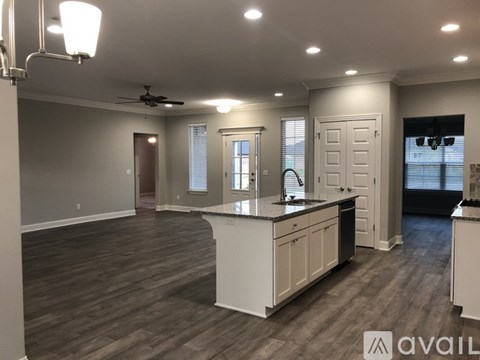 A spacious kitchen with a large island and modern appliances.