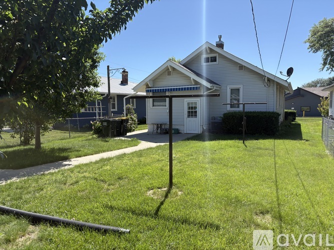 A house with a white door and a small porch.