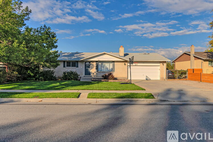 A house with a garage is for sale.