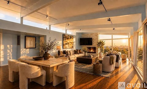 A modern living room with a large table and chairs.