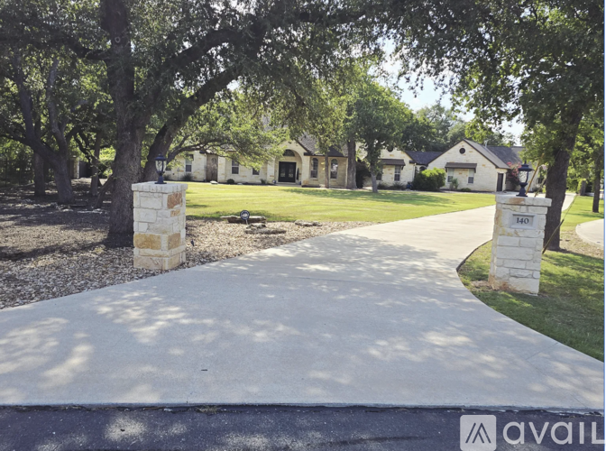 A pathway leads to a cluster of houses with a sign that says "available" in front of them.
