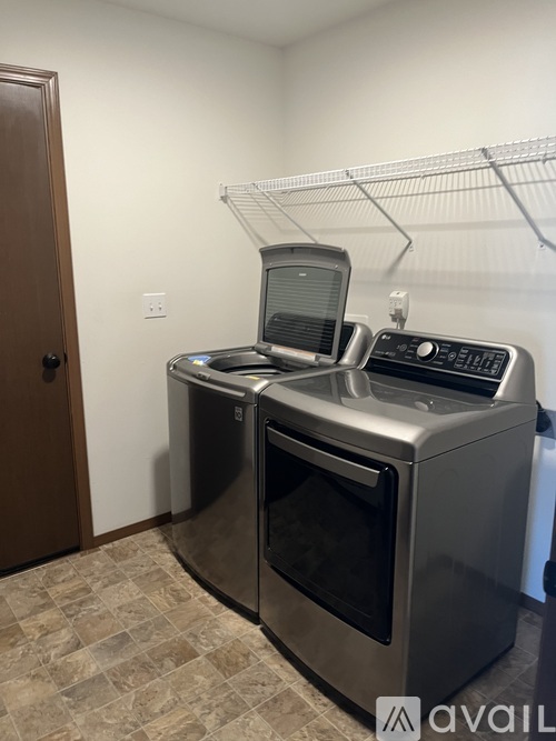 A stainless steel dishwasher and microwave in a kitchen.
