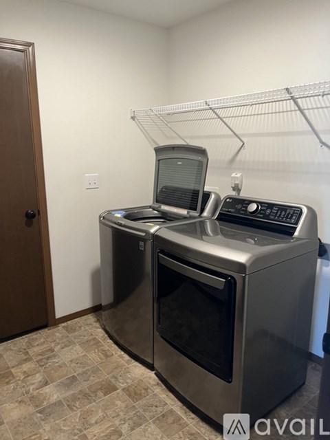 A stainless steel dishwasher and microwave in a kitchen.