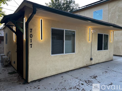 A house with the number 7017 on the front door.