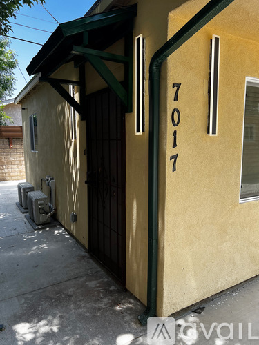 A yellow building with the number 7017 on it.