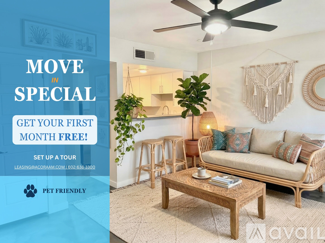A living room with a couch, a coffee table, and a ceiling fan.