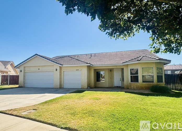 A house with a garage is for sale.