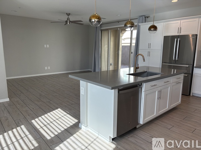 A modern kitchen with a large island in the middle.