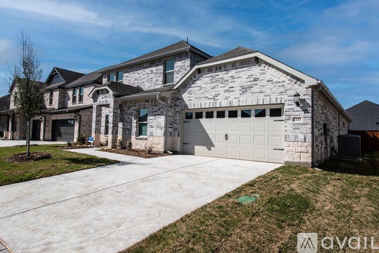 A large house with a stone exterior and a garage.