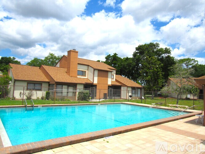 A large house with a pool in the backyard.
