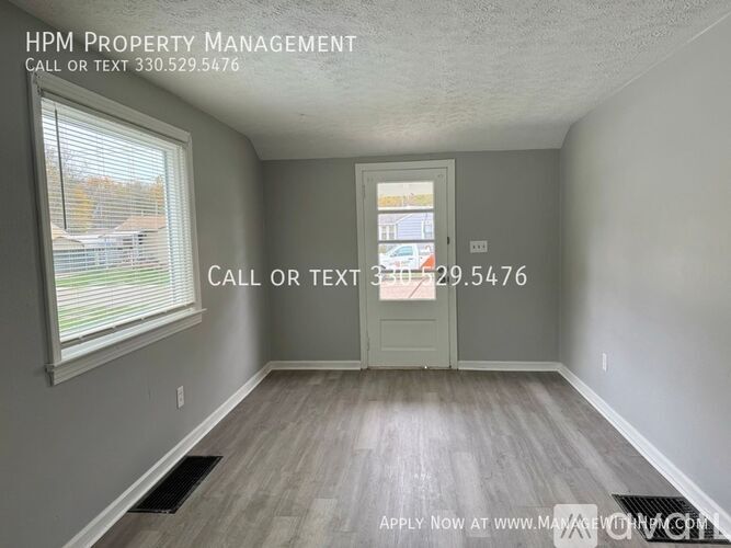 A room with a door and a window, with text indicating it is for HPM Property Management.