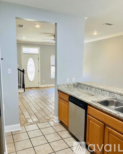 A kitchen with a dishwasher and a sink.