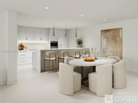 A modern kitchen with a dining table set for four.