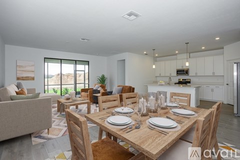 A dining room with a wooden table set for six.