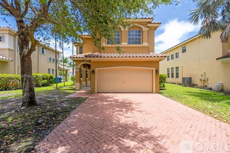 A house with a driveway in front of it.