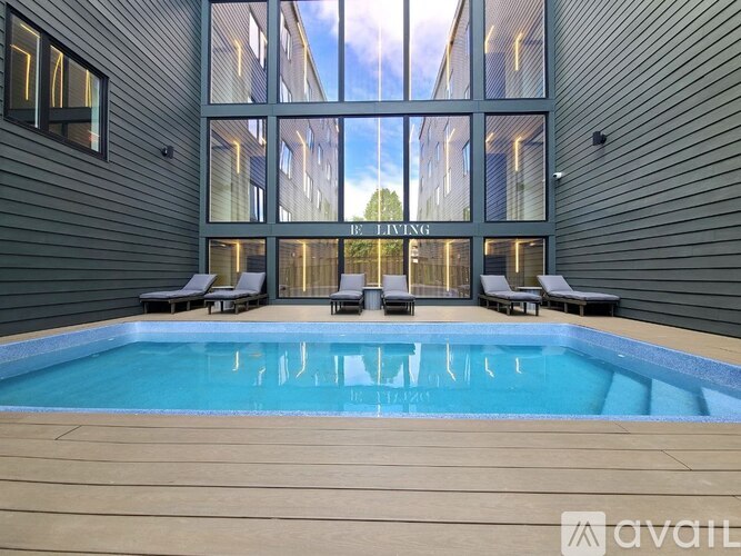 A modern house with a pool in the backyard.