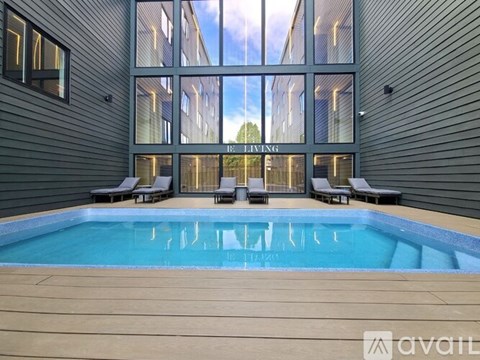 A modern house with a pool in the backyard.