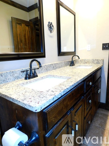 A bathroom with a sink and mirror.