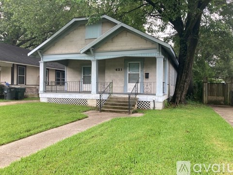 A house with a blue door and a porch.